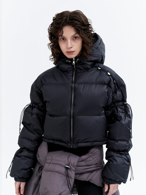 Black jumper with a trimmed down string
